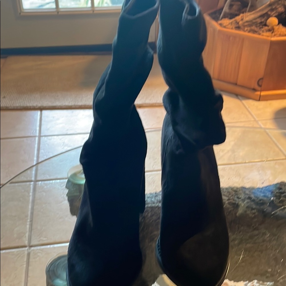 Sleek Black Heeled Boots for Stylish Outings/ size 7